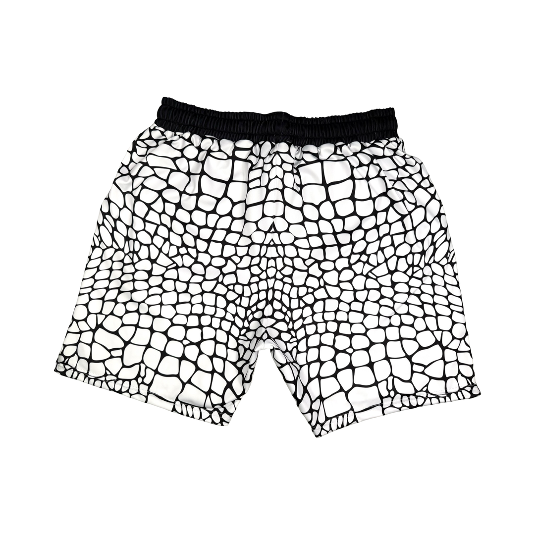 Yt Fang Soft Quick-Dry basketball shorts in white and black reptile-scale pattern with above-knee cut and signature Trap’N Shorts logo.