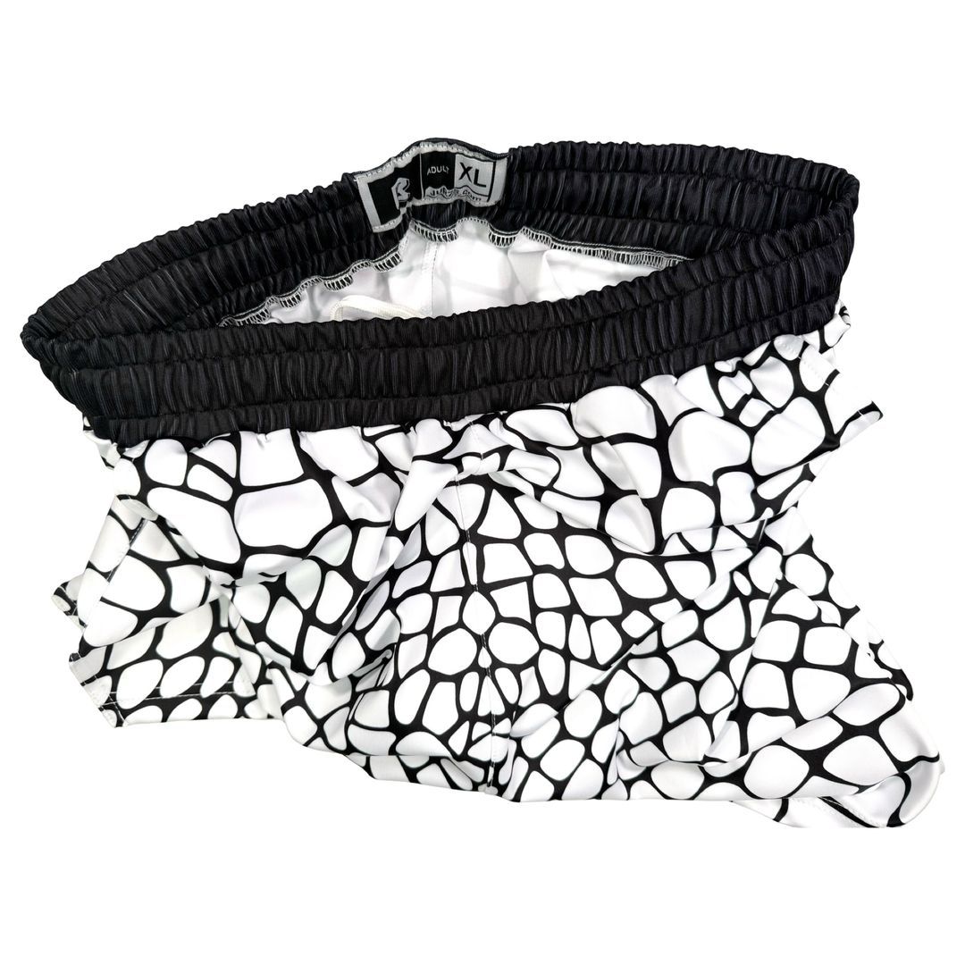 Yt Fang Soft Quick-Dry basketball shorts in white and black reptile-scale pattern with above-knee cut and signature Trap’N Shorts logo.