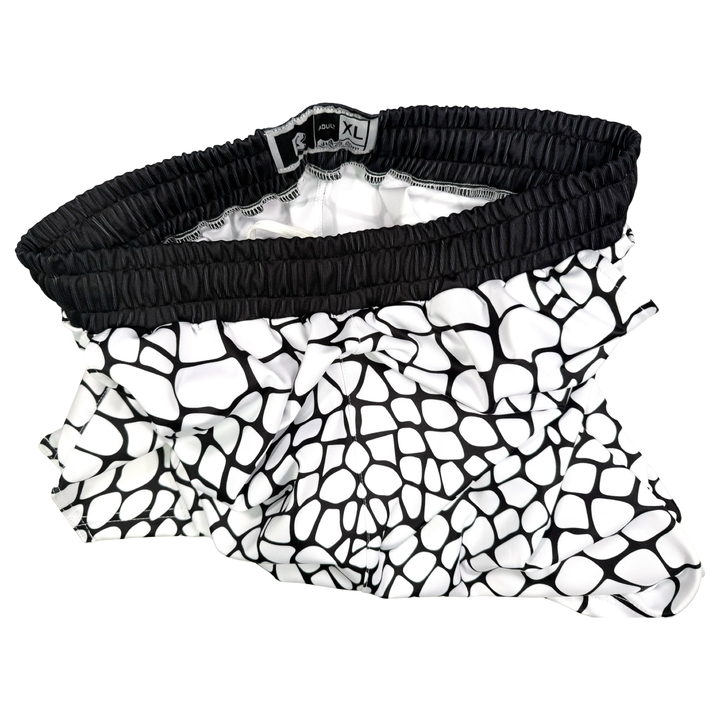 Yt Fang Soft Quick-Dry basketball shorts in white and black reptile-scale pattern with above-knee cut and signature Trap’N Shorts logo.