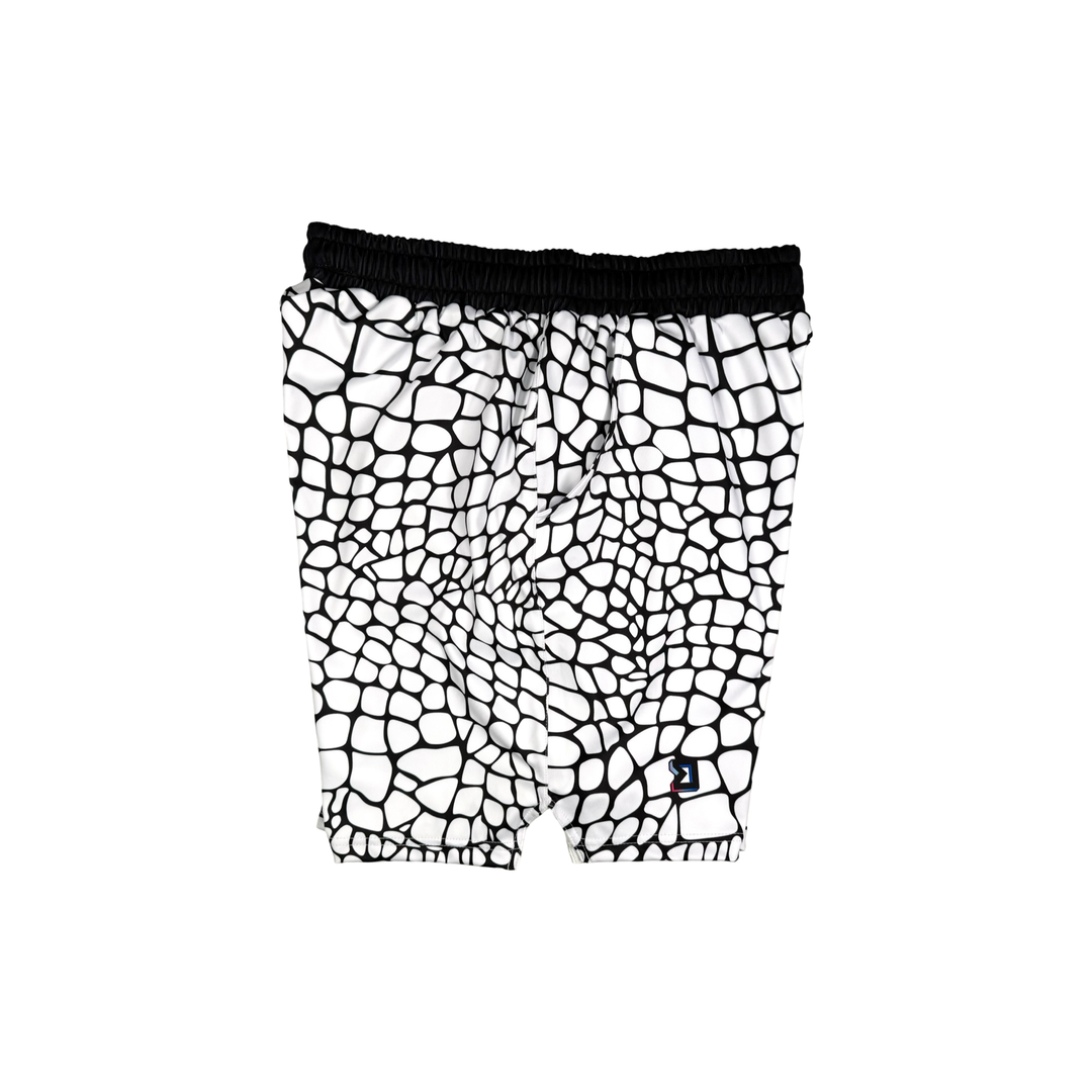 Yt Fang Soft Quick-Dry basketball shorts in white and black reptile-scale pattern with above-knee cut and signature Trap’N Shorts logo.
