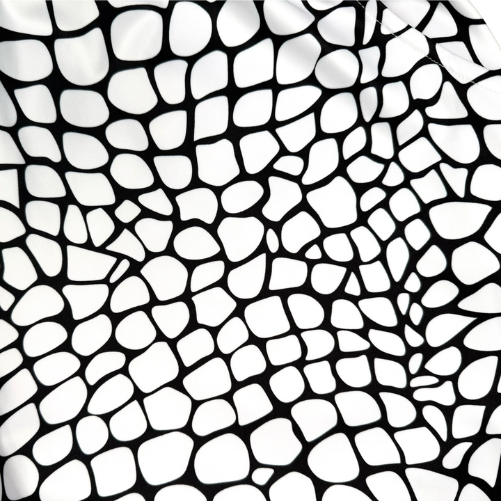 Yt Fang Soft Quick-Dry basketball shorts in white and black reptile-scale pattern with above-knee cut and signature Trap’N Shorts logo.